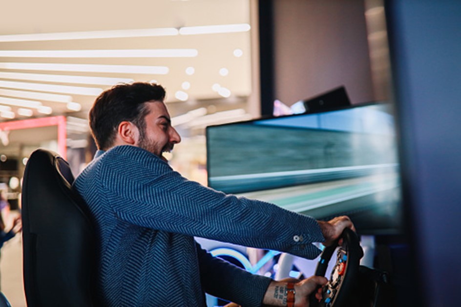 A customer enjoying a sim racing event on Assetto Corsa software