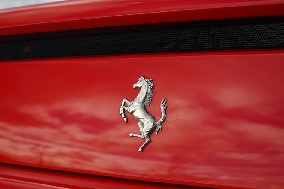 The Ferrari badge of a 355 GTS