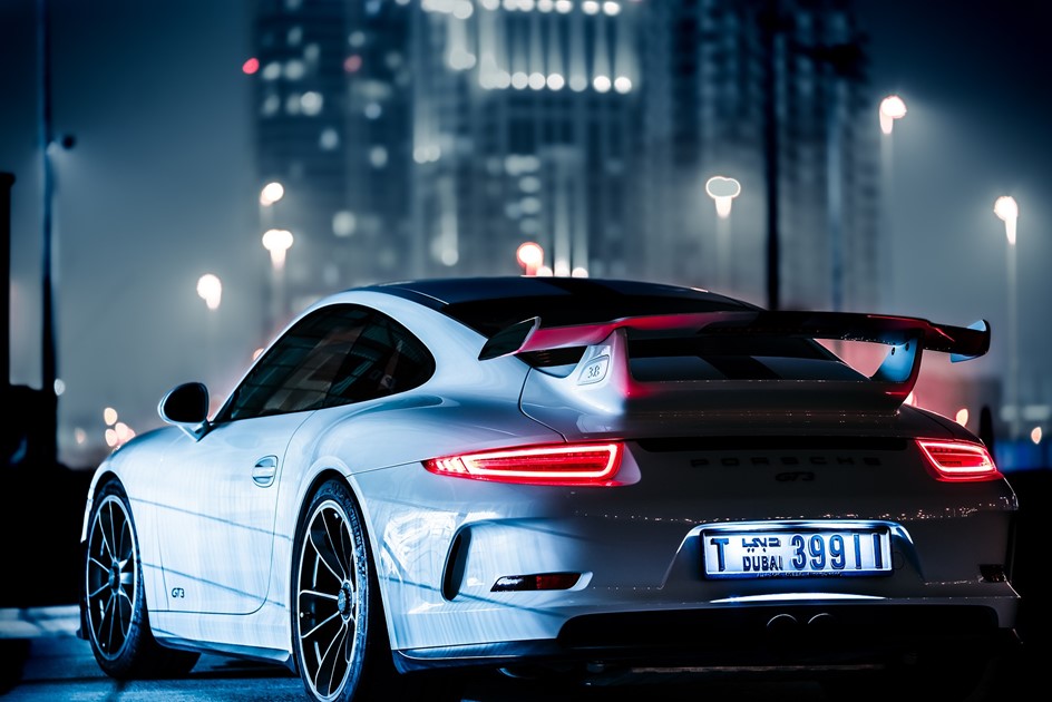 Porsche 911 GT3 RS parked in a city at night