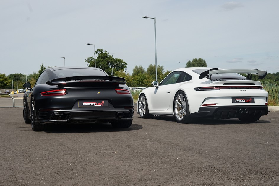 The rear ends of the Porsche 991.2 911 Turbo S and 992 GT3