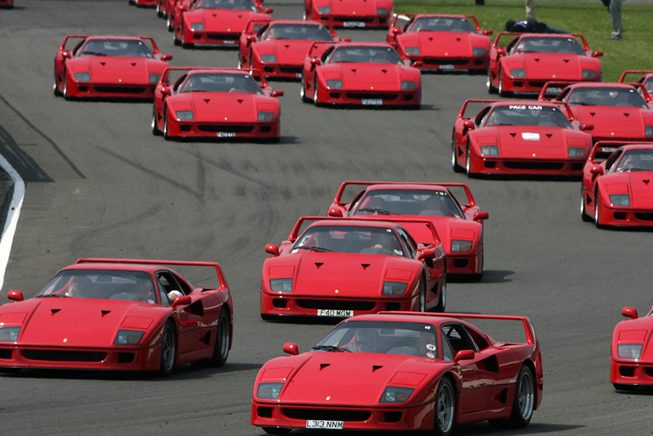 A huge collection of Ferrari F40s on track at the Silverstone Classic